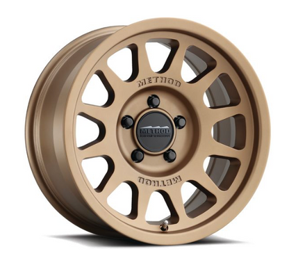 MR703 BEAD GRIP 17X9 12MM OS 5X5 71.5MM CB METHOD BRONZE (Check Description For Vehicles This Fits)